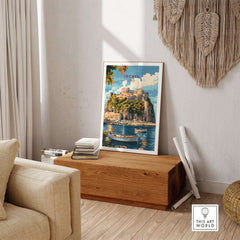 Ischia Travel Print Italy displayed in a stylish home interior with wooden furniture and a calm seaside view.
