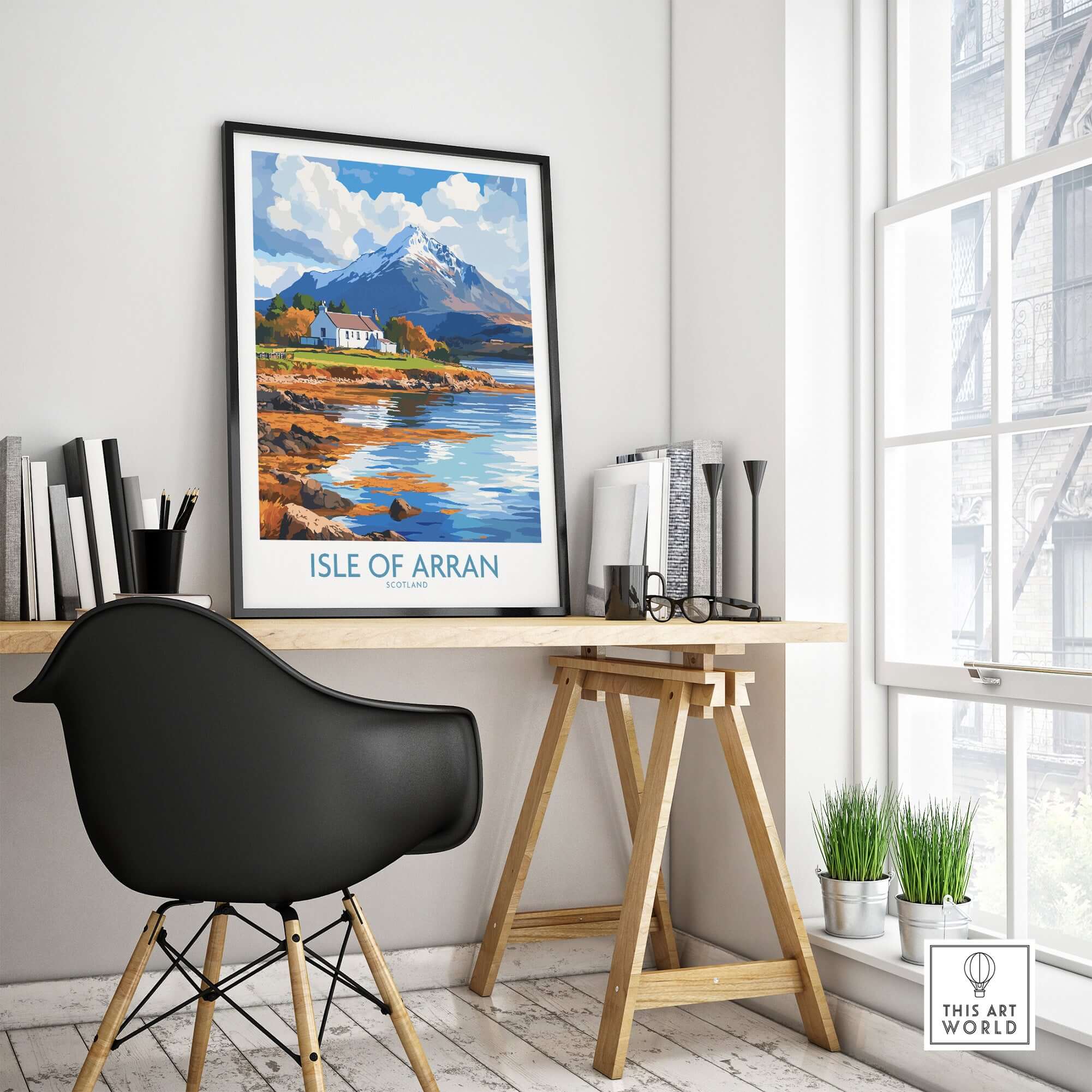 Isle of Arran Poster displayed in a modern workspace, showcasing the scenic beauty of Scotland.