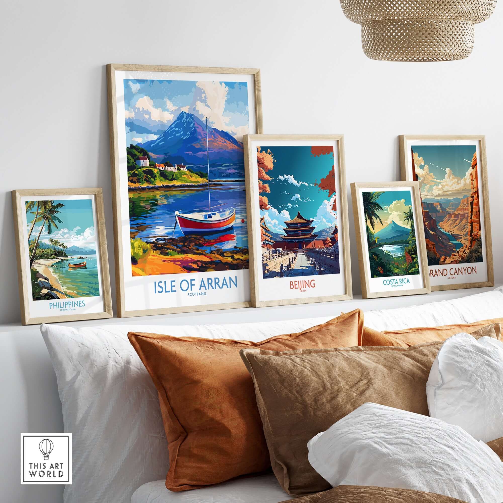 Isle of Arran Poster Scotland displayed among various travel posters in a modern living space.
