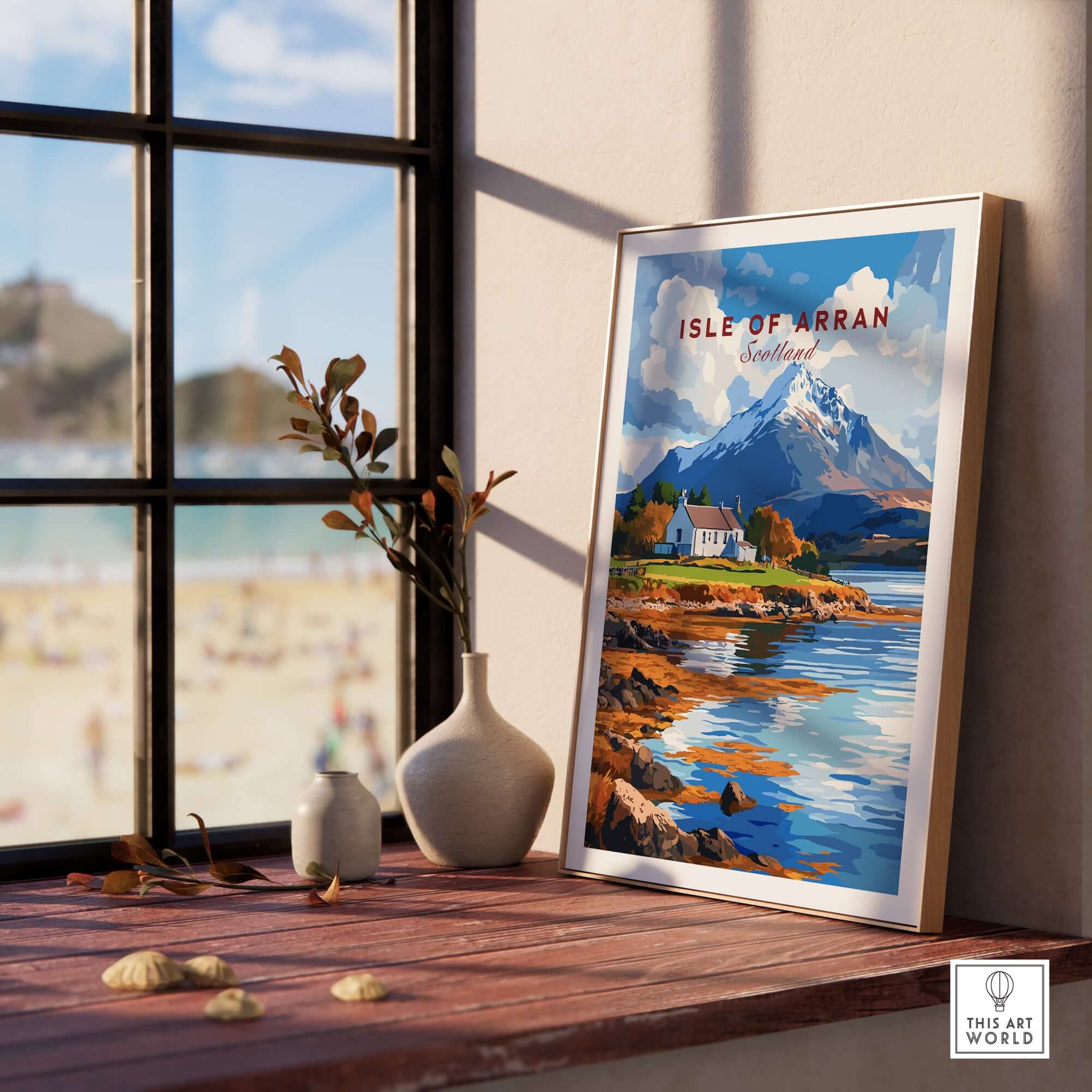 Isle of Arran Print showcasing a stunning Scottish landscape in a stylish frame on a windowsill.