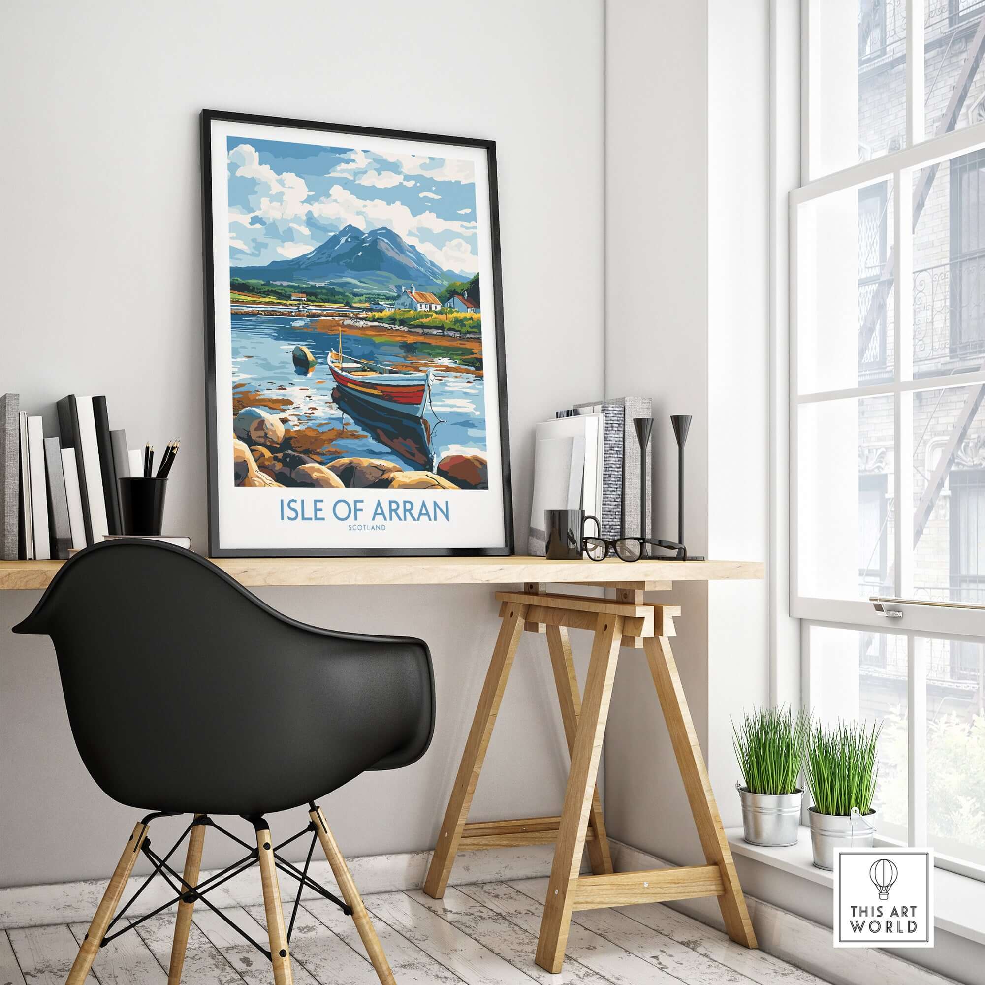 Isle of Arran Scotland Travel Poster displayed in a stylish workspace featuring beautiful landscapes.