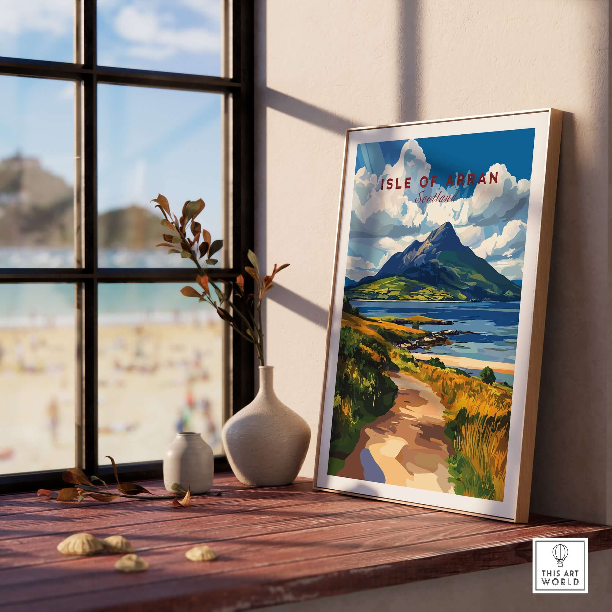Isle of Arran Scotland Wall Art displayed on a windowsill, showcasing stunning landscapes of Scotland.