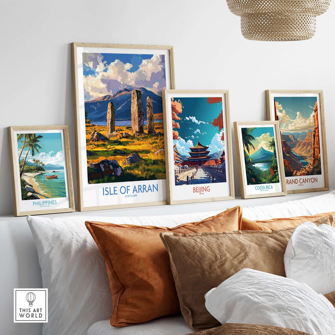 A collection of travel posters featuring the Isle of Arran, Beijing, Costa Rica, and the Grand Canyon displayed in elegant frames.