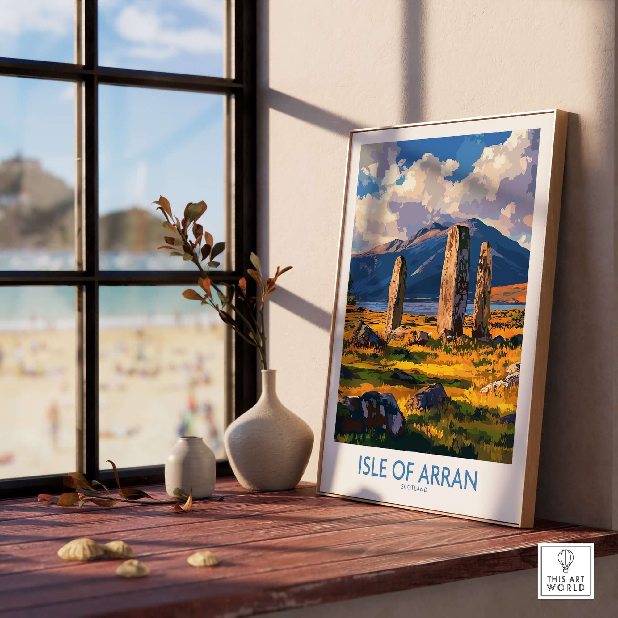 Isle of Arran Travel Poster displayed indoors featuring the Machrie Moor Standing Stones and beautiful landscape.