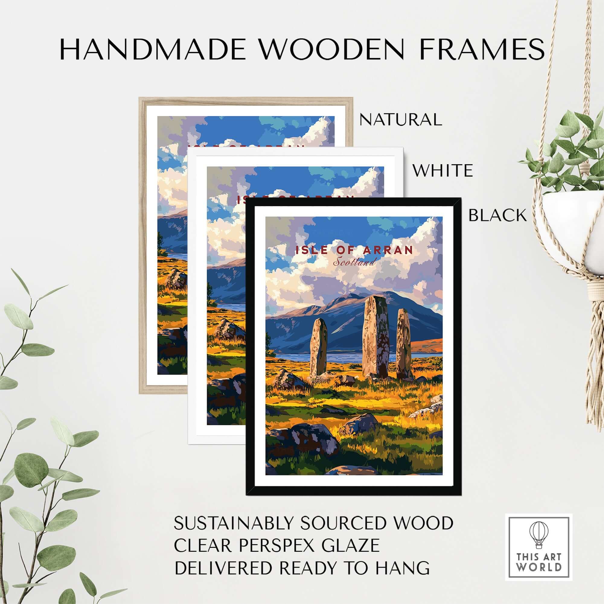 Isle of Arran Travel Print displayed in handmade wooden frames in natural, white, and black finishes.