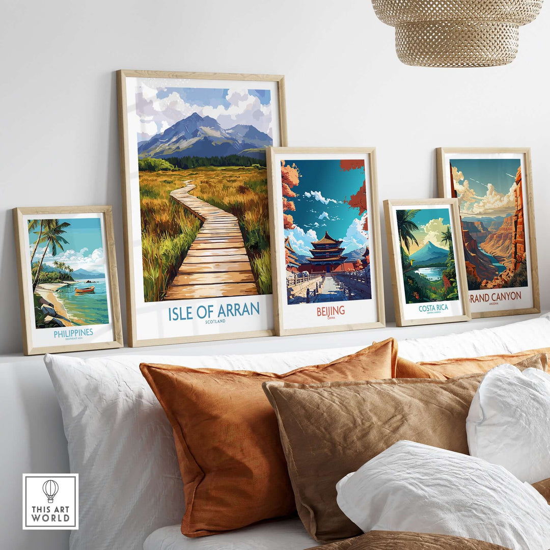 Beautiful Isle of Arran Wall Art Print among travel-themed prints on a stylish couch, perfect for home decor.