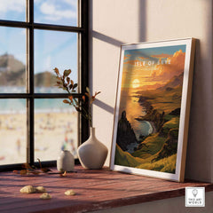 Isle of Skye Art Print displayed on a table with a scenic view of a beach and sunset in the background.