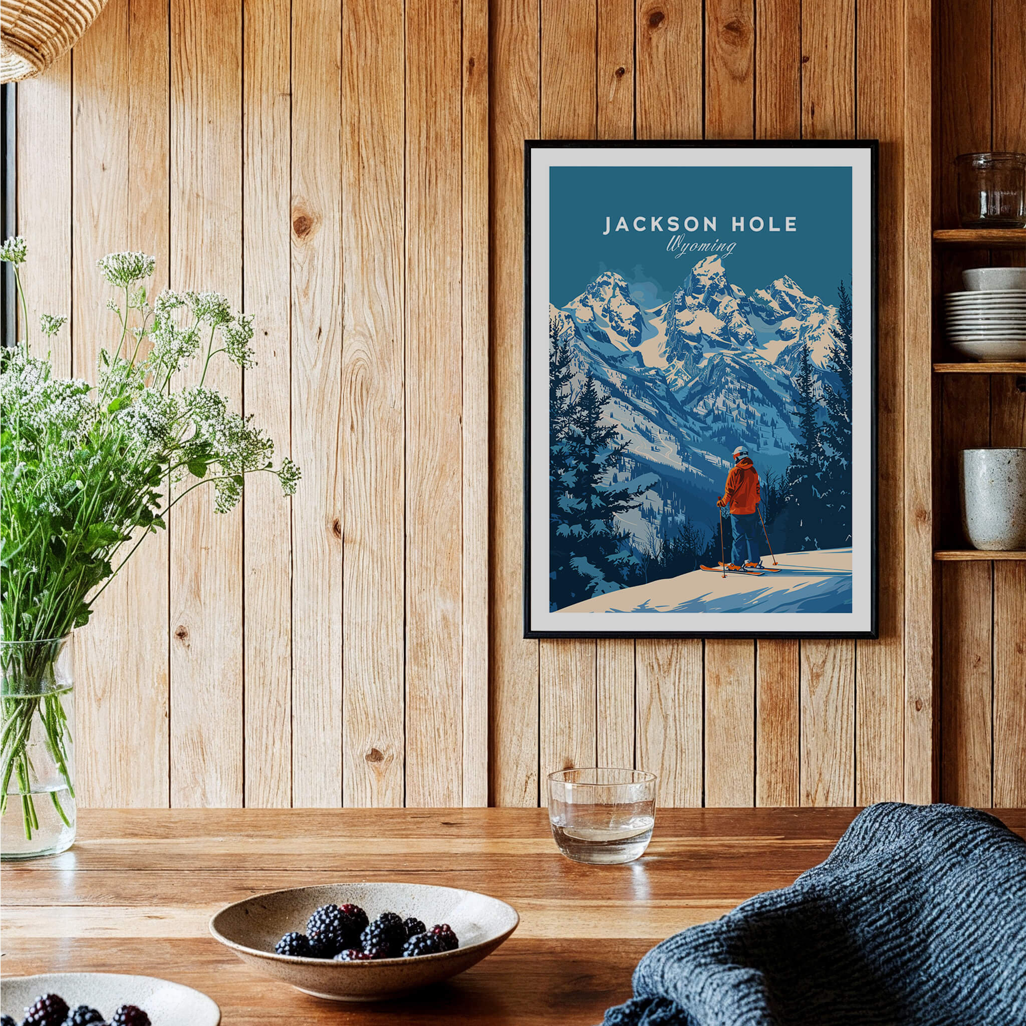 Jackson Hole Ski Poster - Wyoming displayed on wooden wall, showcasing stunning snowy mountains and a skier in red.