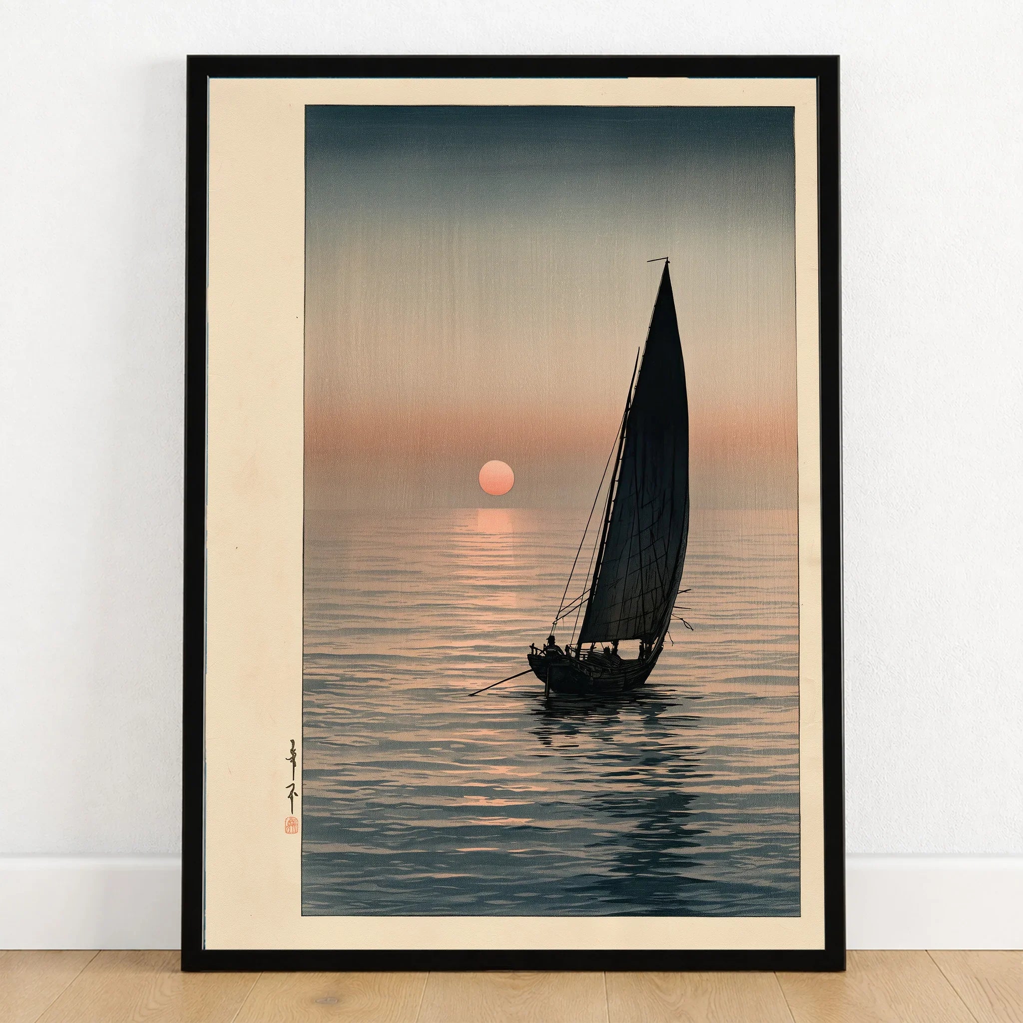 Japanese Sunset Seascape Art Print – Vintage Boat Wall Art — art print in black frame on wooden floor
