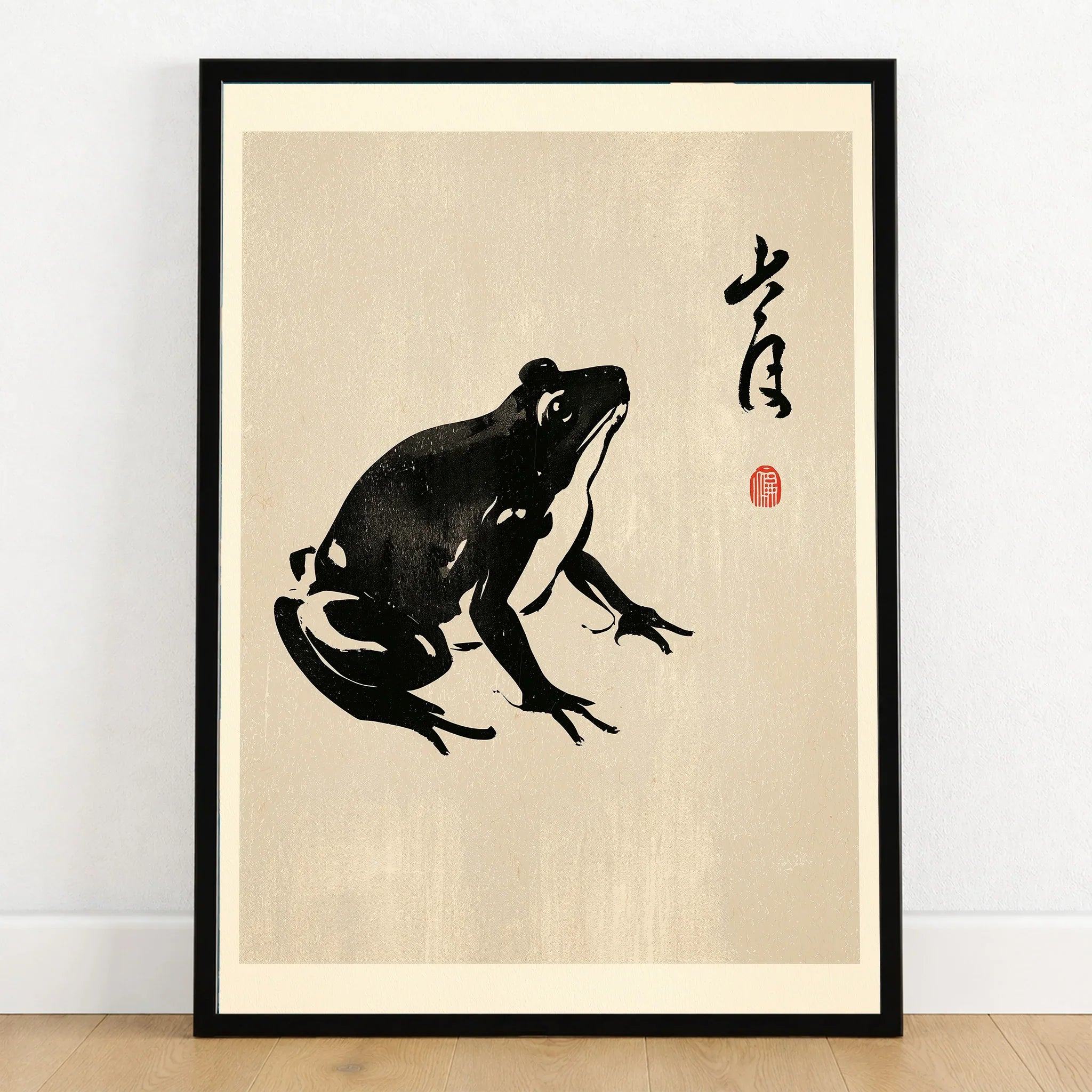 Japanese Frog Art Print – Vintage Ukiyo-e Style Wall Art — art print in black frame on wooden floor