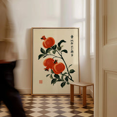 Japanese Pomegranate Art Print – Vintage Botanical Wall Art — framed canvas on floor man walking past