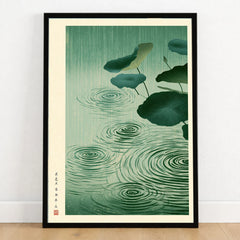 Japanese Lotus Pond Art Print – Rainy Vintage Wall Art — art print in black frame on wooden floor