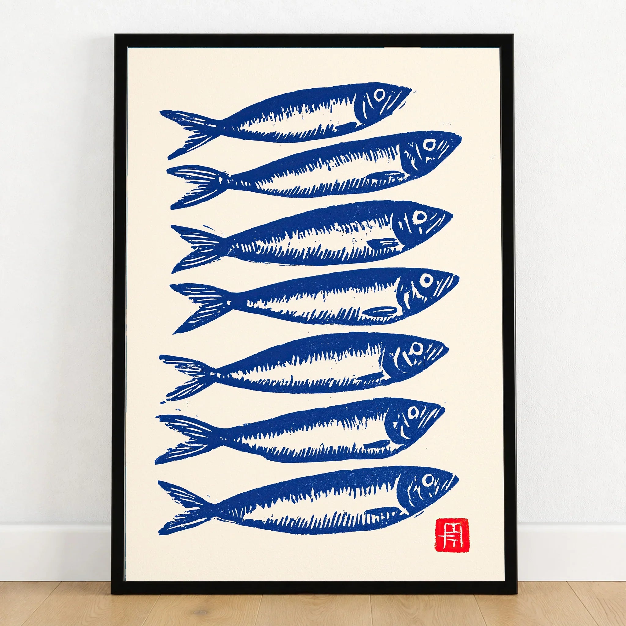Japanese Fish Art Print – Blue Sardine Coastal Wall Art — art print in black frame on wooden floor