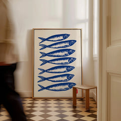 Japanese Fish Art Print – Blue Sardine Coastal Wall Art — framed canvas on floor man walking past