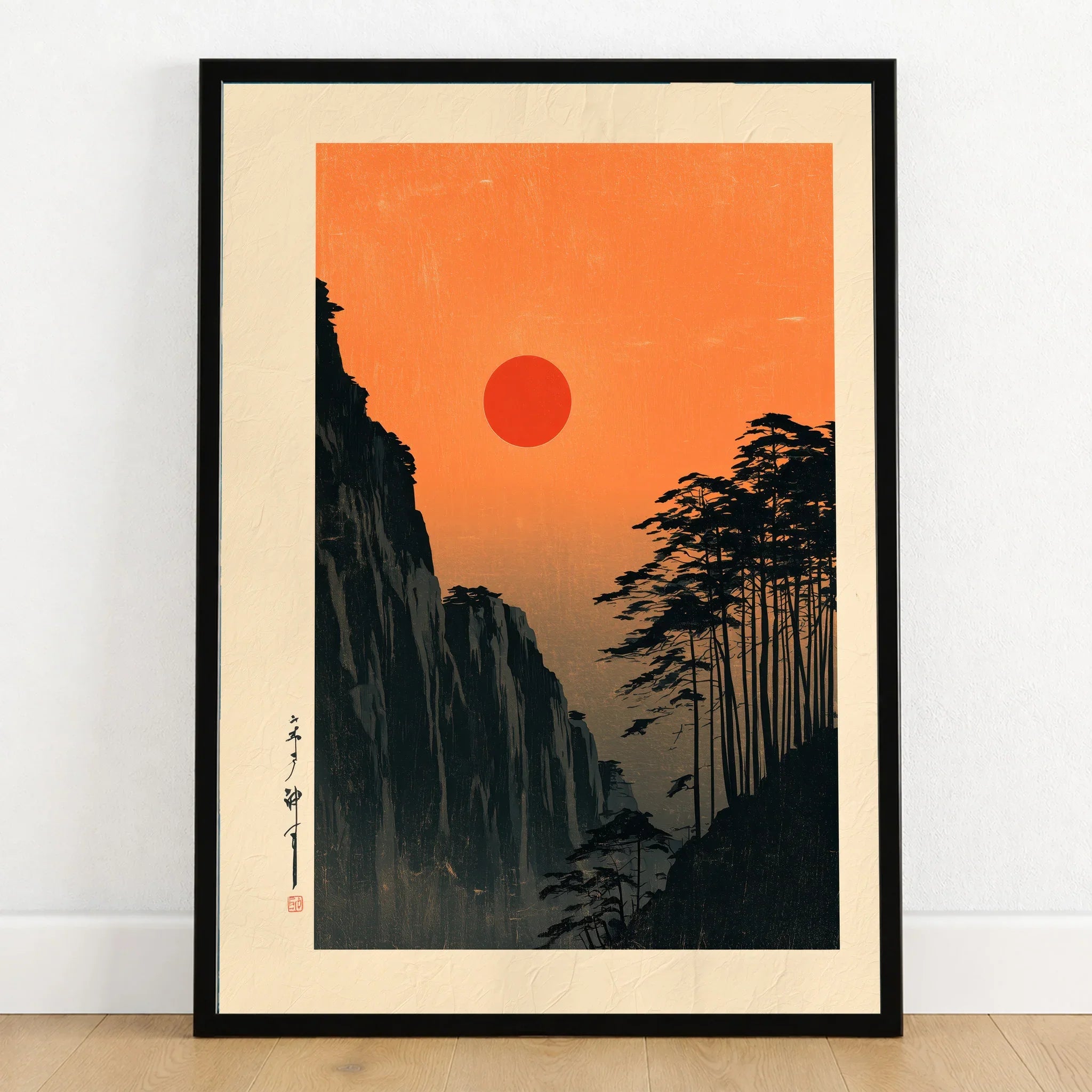 Red Sun Japanese Art Print – Vintage Sunset Wall Art — art print in black frame on wooden floor