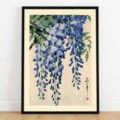 Japanese Wisteria Art Print – Blue Floral Botanical Wall Art — art print in black frame on wooden floor