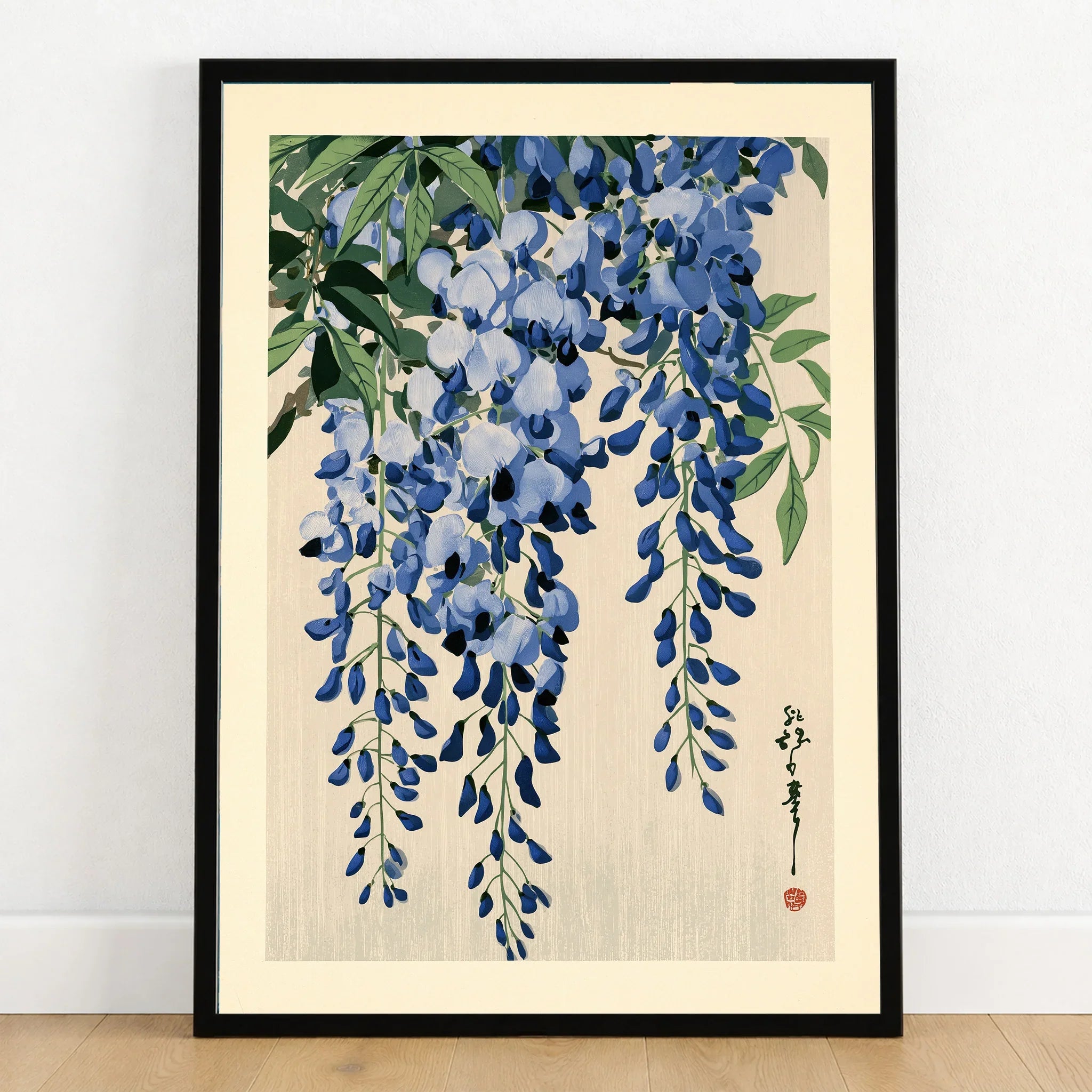 Japanese Wisteria Art Print – Blue Floral Botanical Wall Art — art print in black frame on wooden floor