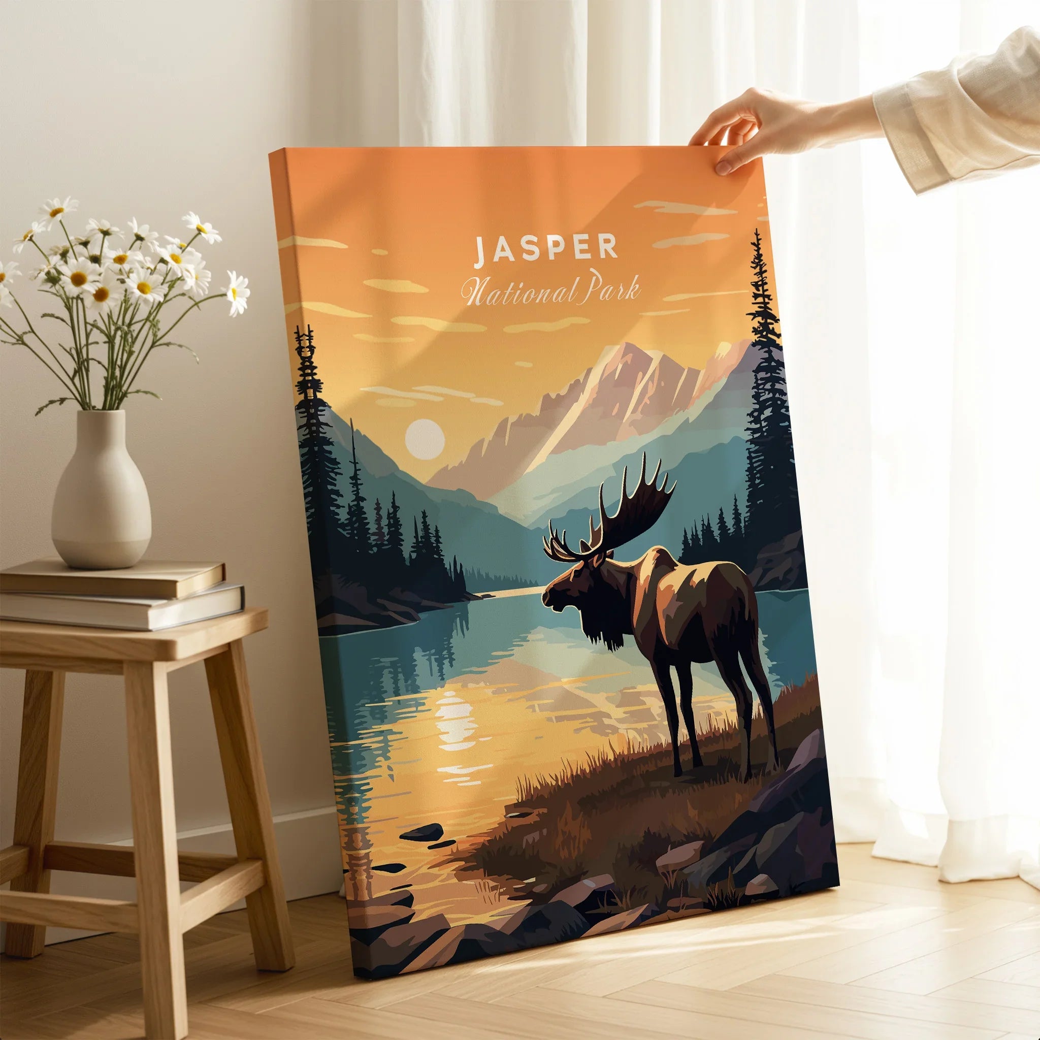 Jasper National Park moose art print, hand holding retro travel poster in cozy room