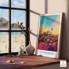 Joburg Skyline Poster - Johannesburg, South Africa Premium Cityscape Art displayed on a wooden shelf beside a window.