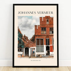Framed wall art print of Johannes Vermeer’s The Little Street, red brick Dutch houses.
