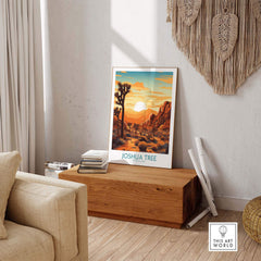 Joshua Tree Wall Art Poster displayed in a modern living room with sunset colors and desert scenery.