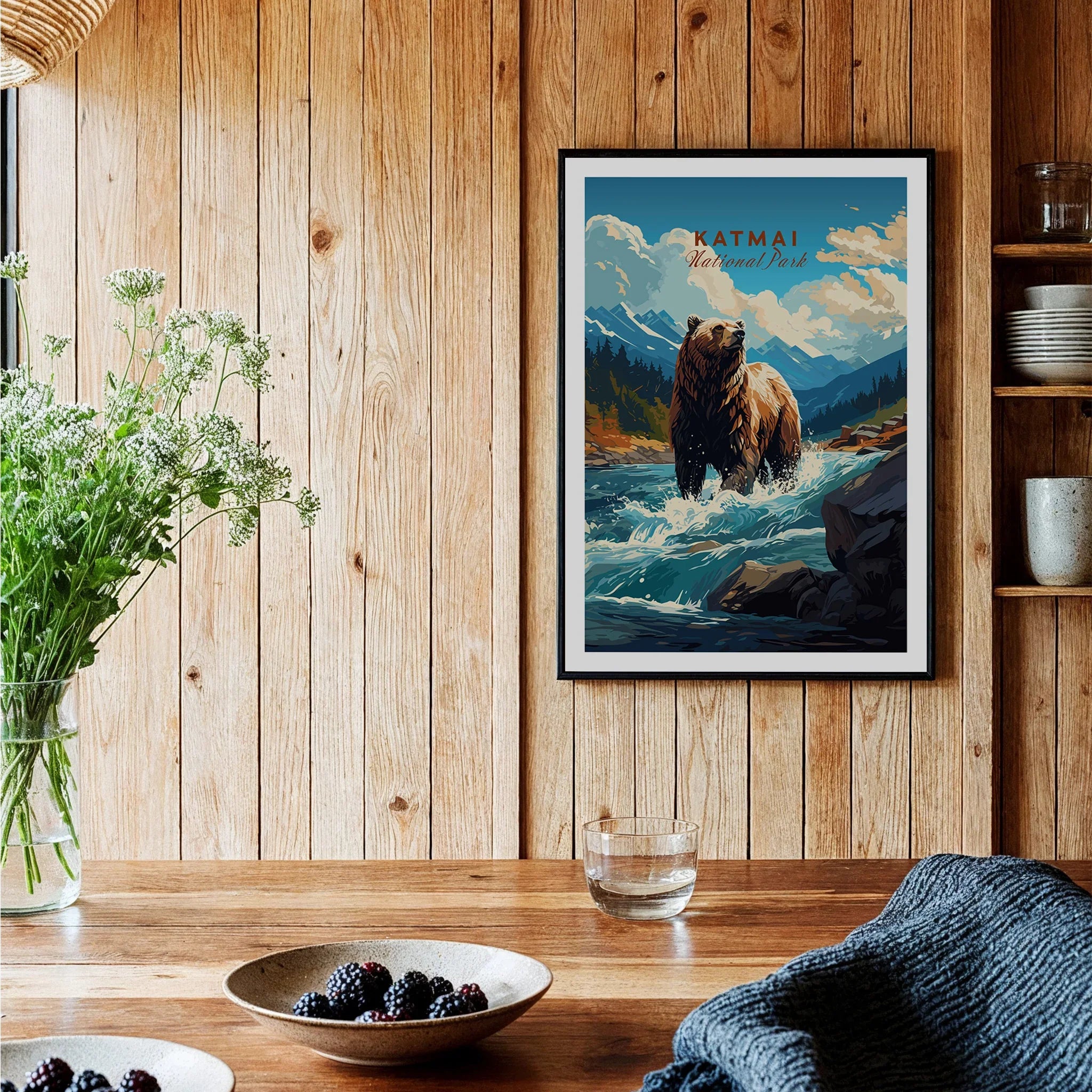 Framed Katmai National Park bear art print on wood wall in cozy kitchen setting