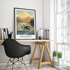 Kenai Fjords National Park Print featuring orcas and a mountain landscape, framed on a desk in a modern interior.