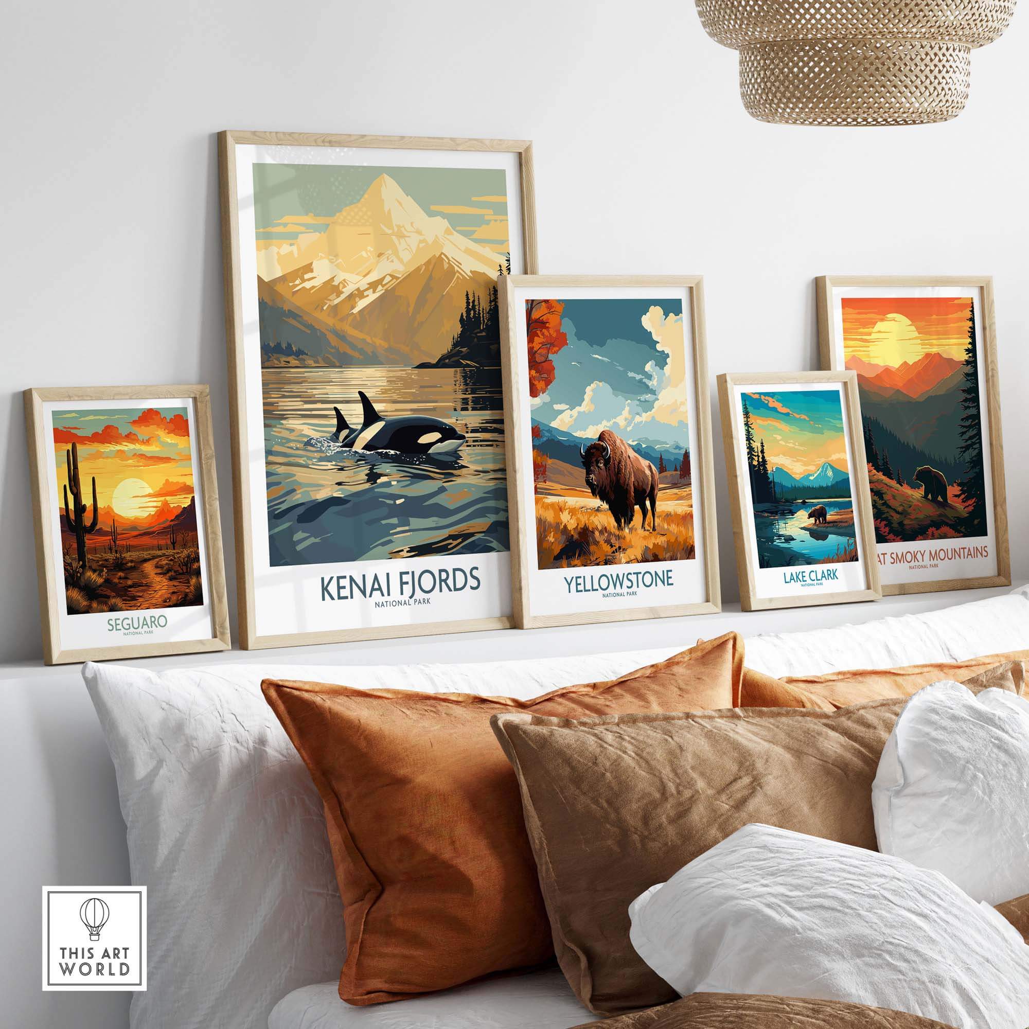 Kenai Fjords National Park print featuring orcas in an Alaskan sunset, displayed among national park posters on a stylish wall.