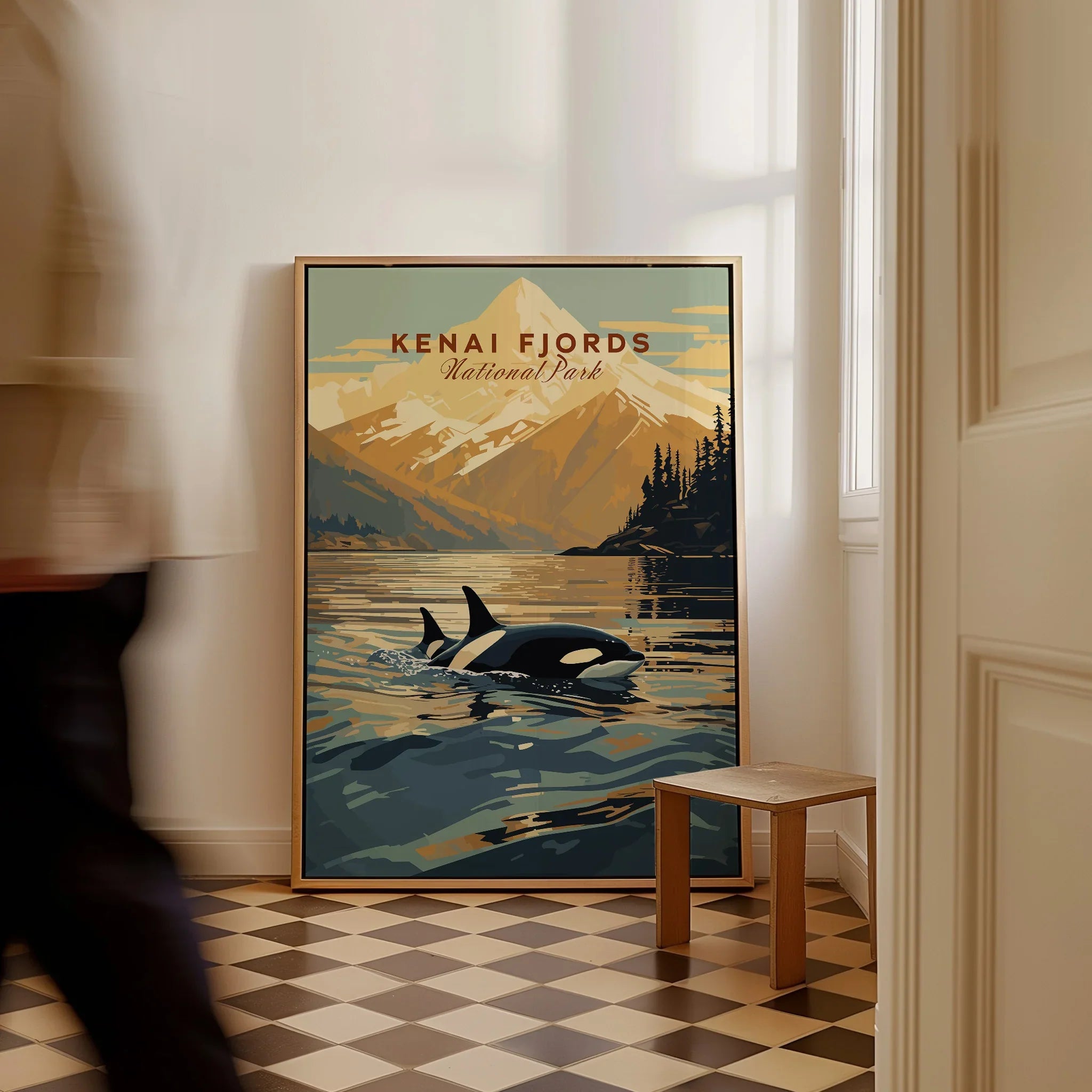 Kenai Fjords National Park travel poster with orca and mountain, framed on floor in entryway