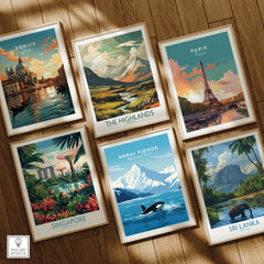 Set of six framed travel posters featuring Venice, Paris, Scotland Highlands, Singapore, Kenai Fjords, and Sri Lanka on a wooden floor.