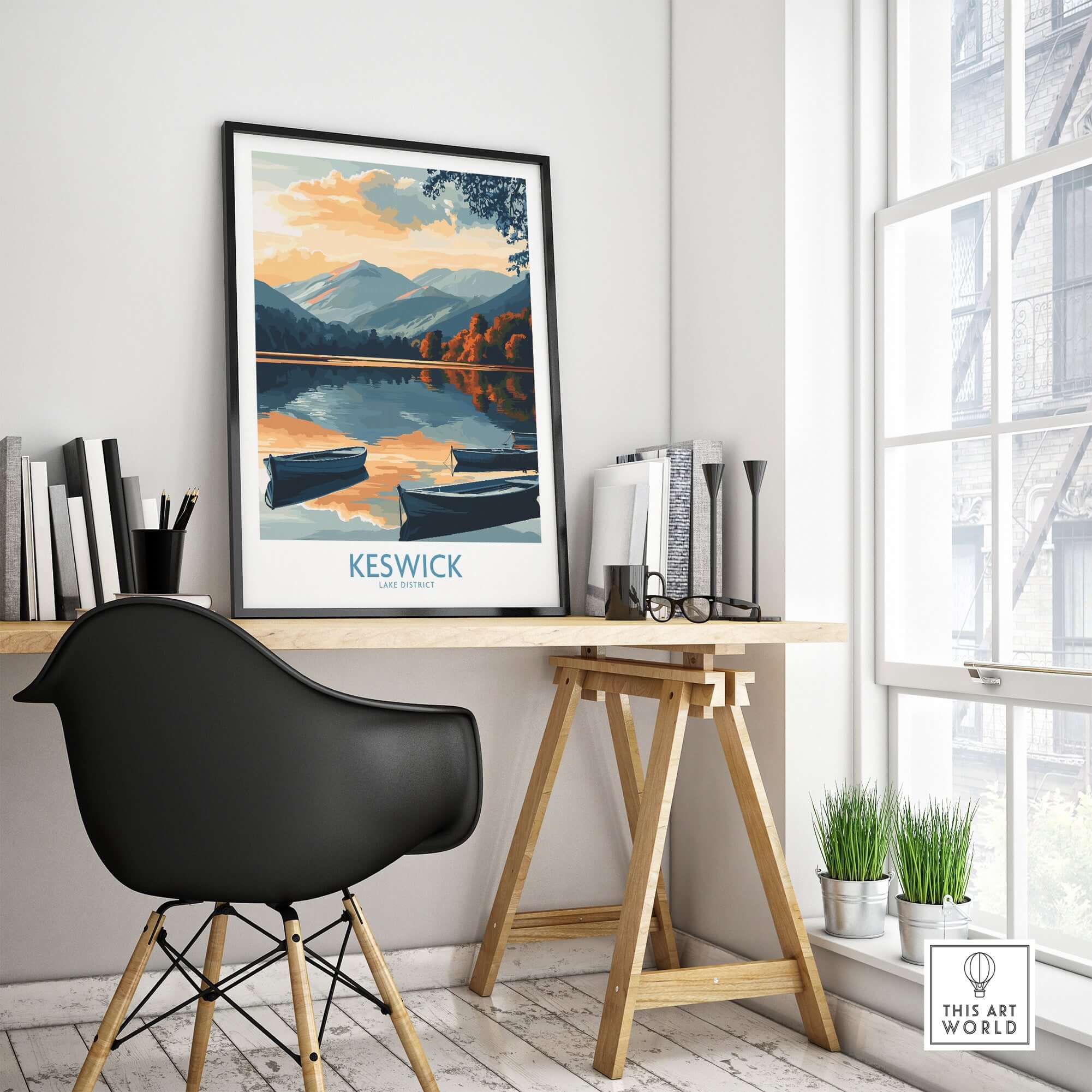Keswick Art Print featuring a serene Lake District landscape with boats and mountains in a stylish workspace.
