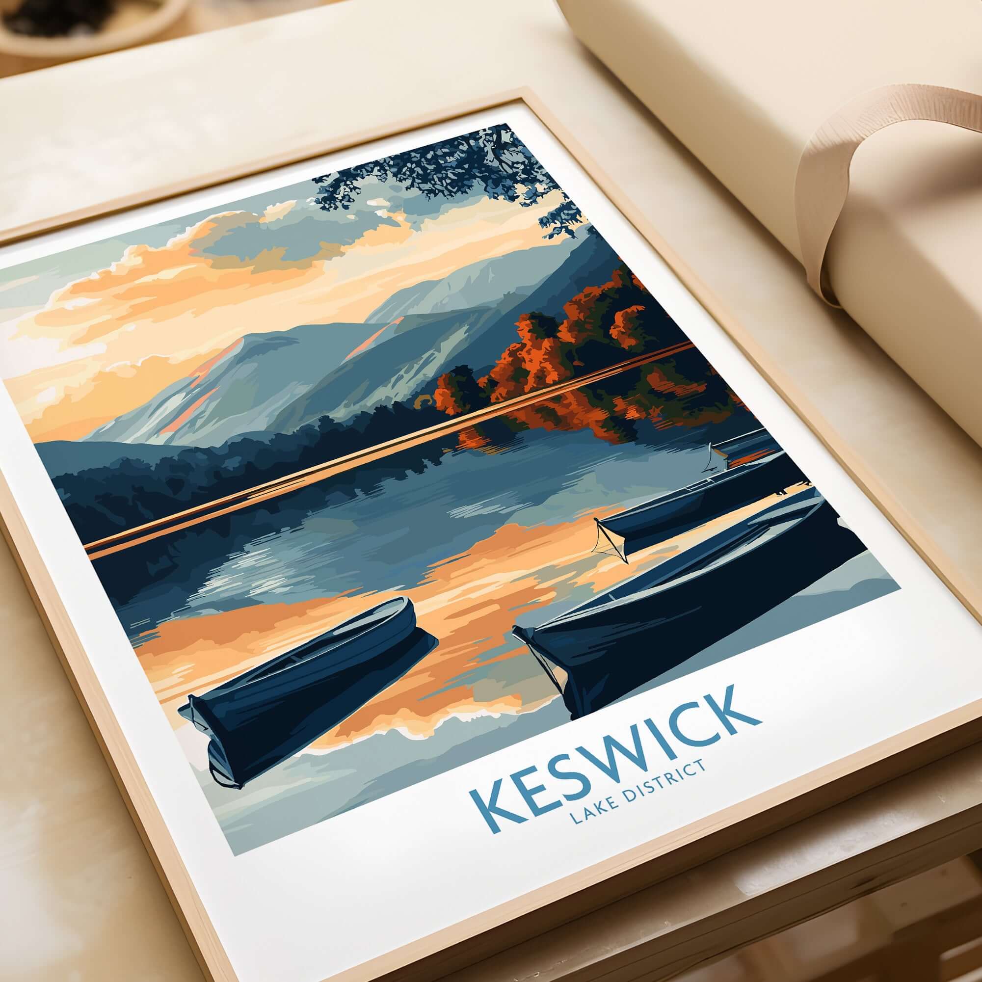 Keswick Art Print featuring a serene Lake District landscape with boats on the water and vibrant sunset reflections.
