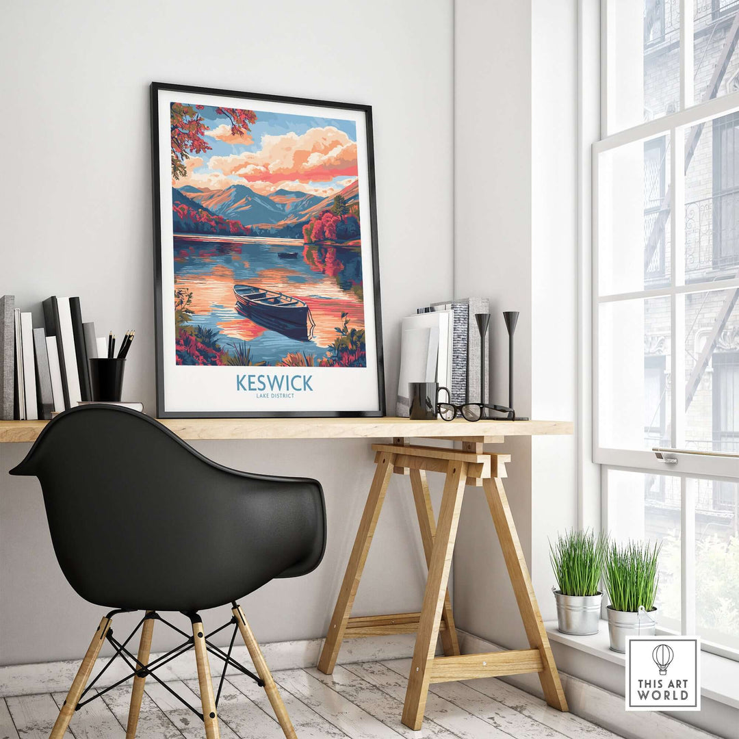 Keswick Lake District travel poster featuring a serene lake sunset, displayed in a modern workspace.