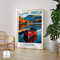 Keswick Poster featuring a picturesque view of a red boat on a tranquil Lake District landscape.