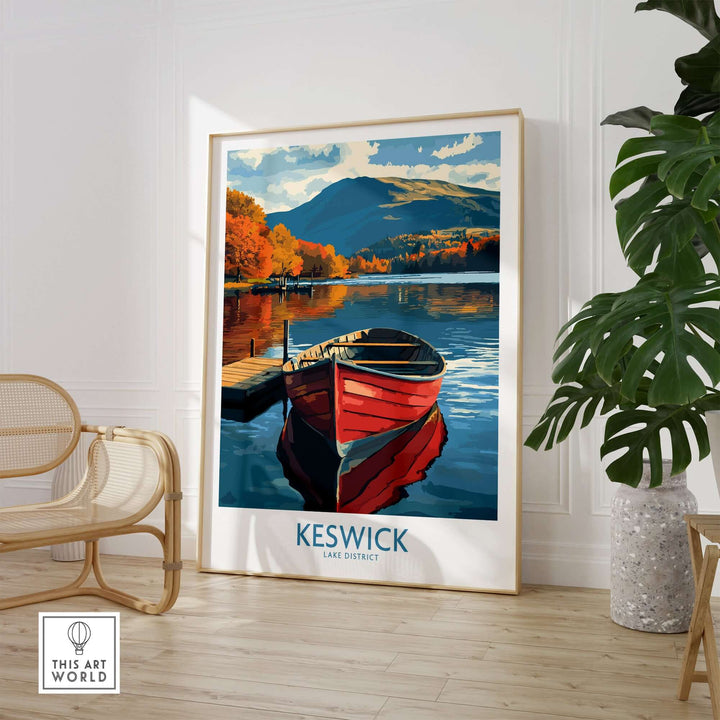 Keswick Poster showcasing a scenic Lake District view with a red boat and autumn colors, framed in a modern interior.