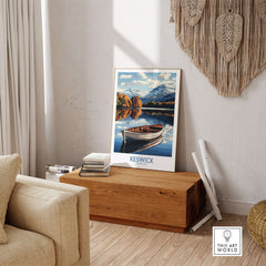 Keswick Poster Lake District displayed in a cozy living room beside a wooden bench, inspiring serenity and beauty.