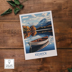 Keswick Poster Lake District featuring a serene boat scene against a scenic backdrop of mountains and trees.