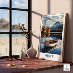 Keswick Poster Lake District featuring a scenic boat and mountains, showcased on a windowsill with natural decor.
