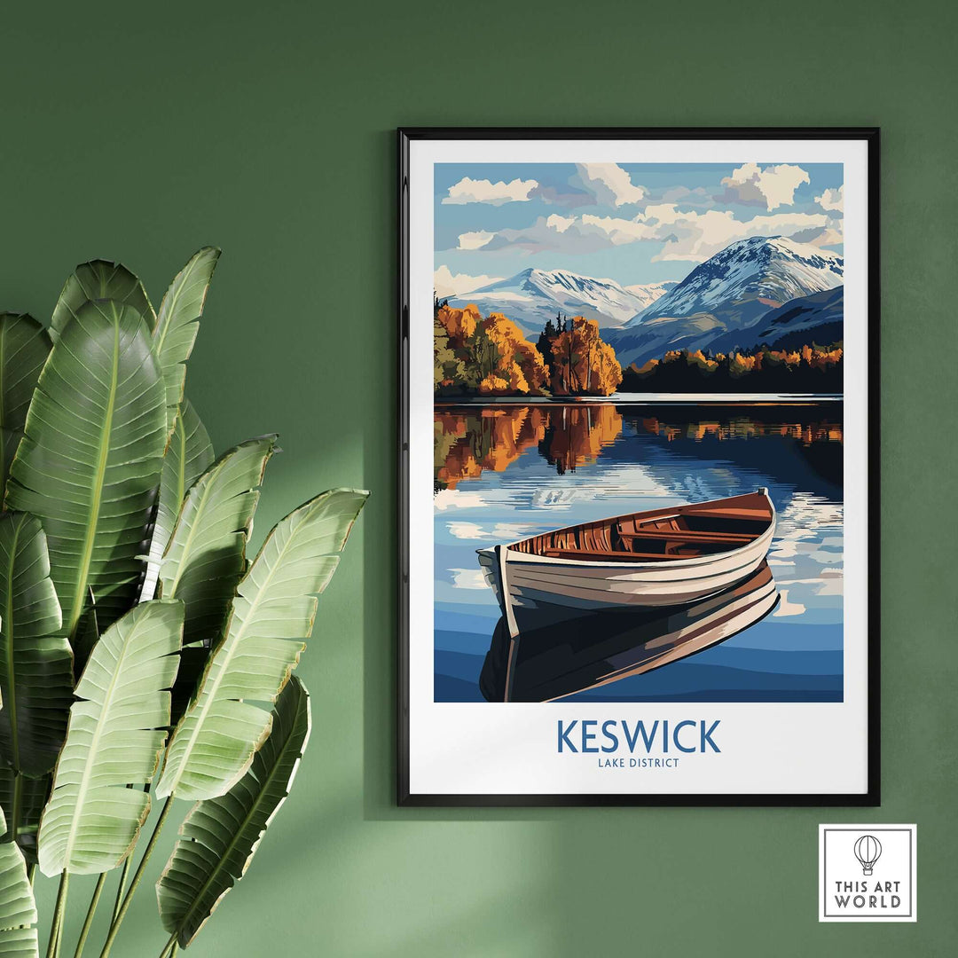 Keswick Poster showcasing a serene lake and mountains in the Lake District, framed and displayed with a plant backdrop.