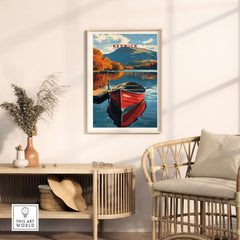 Keswick Print showcasing a red boat on serene waters surrounded by autumn foliage in the Lake District.