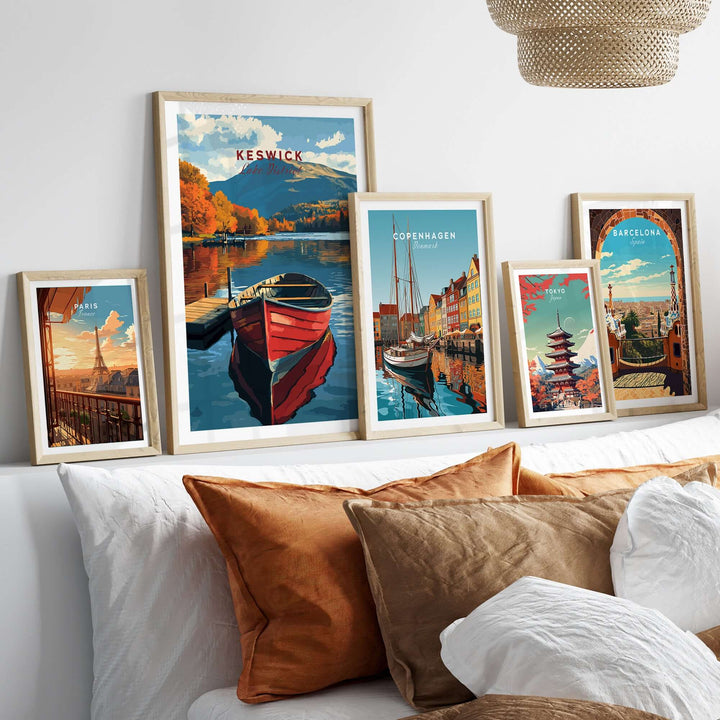 Keswick Print showcasing vibrant Lake District scenery with framed prints of Copenhagen and Barcelona on a stylish bed.