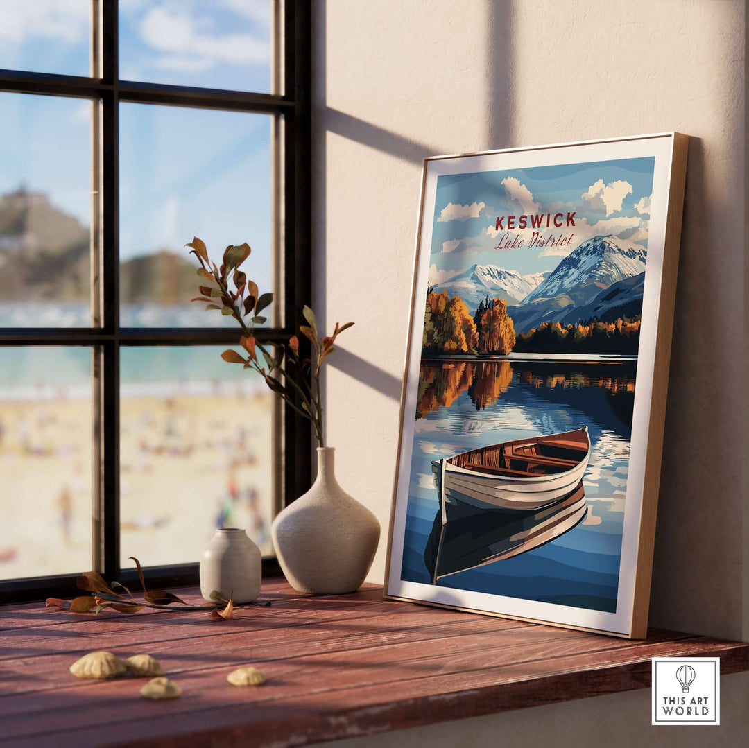 Framed Keswick Print of Lake District featuring a serene landscape with mountains and a boat on a tranquil lake.