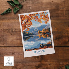 Keswick Travel Poster showcasing stunning autumn scenery of the Lake District with vibrant orange leaves.
