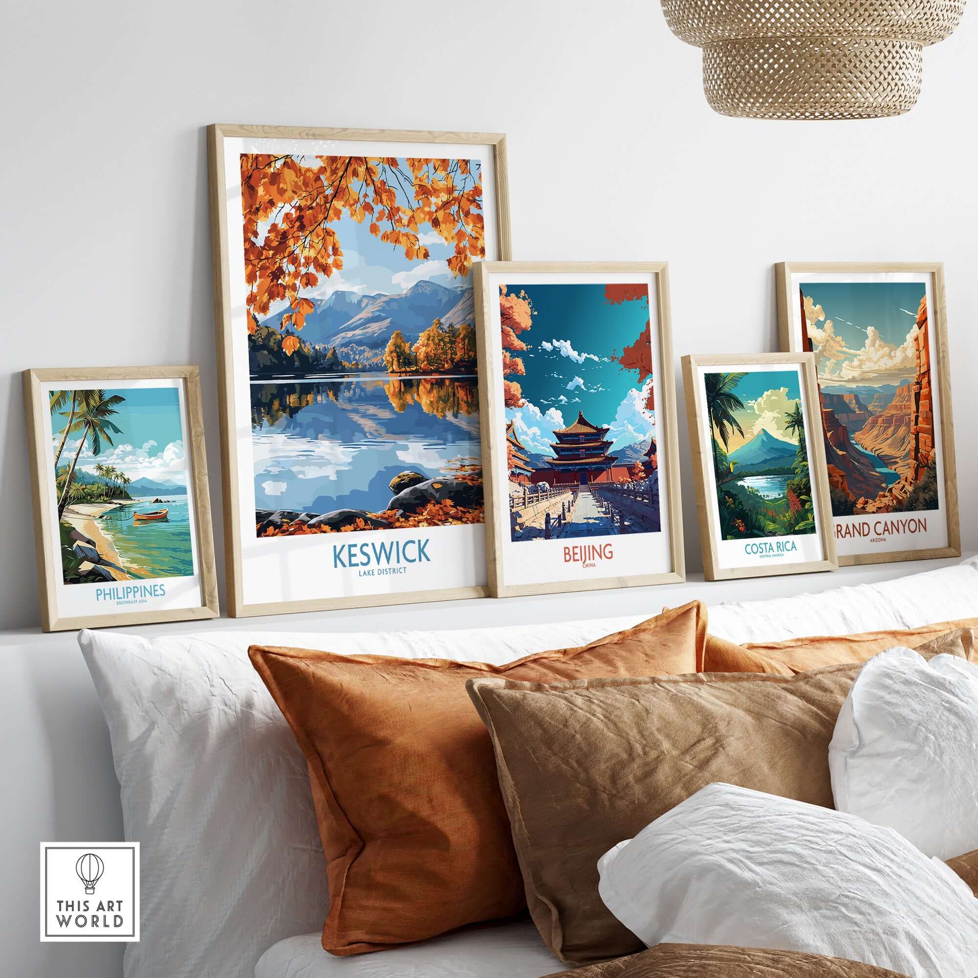 Keswick Travel Poster displayed among other travel posters on a stylish wall, showcasing stunning nature-filled scenery.