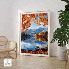 Keswick Travel Print showcasing autumn colors and tranquil scenery of Lake District reflected in water.