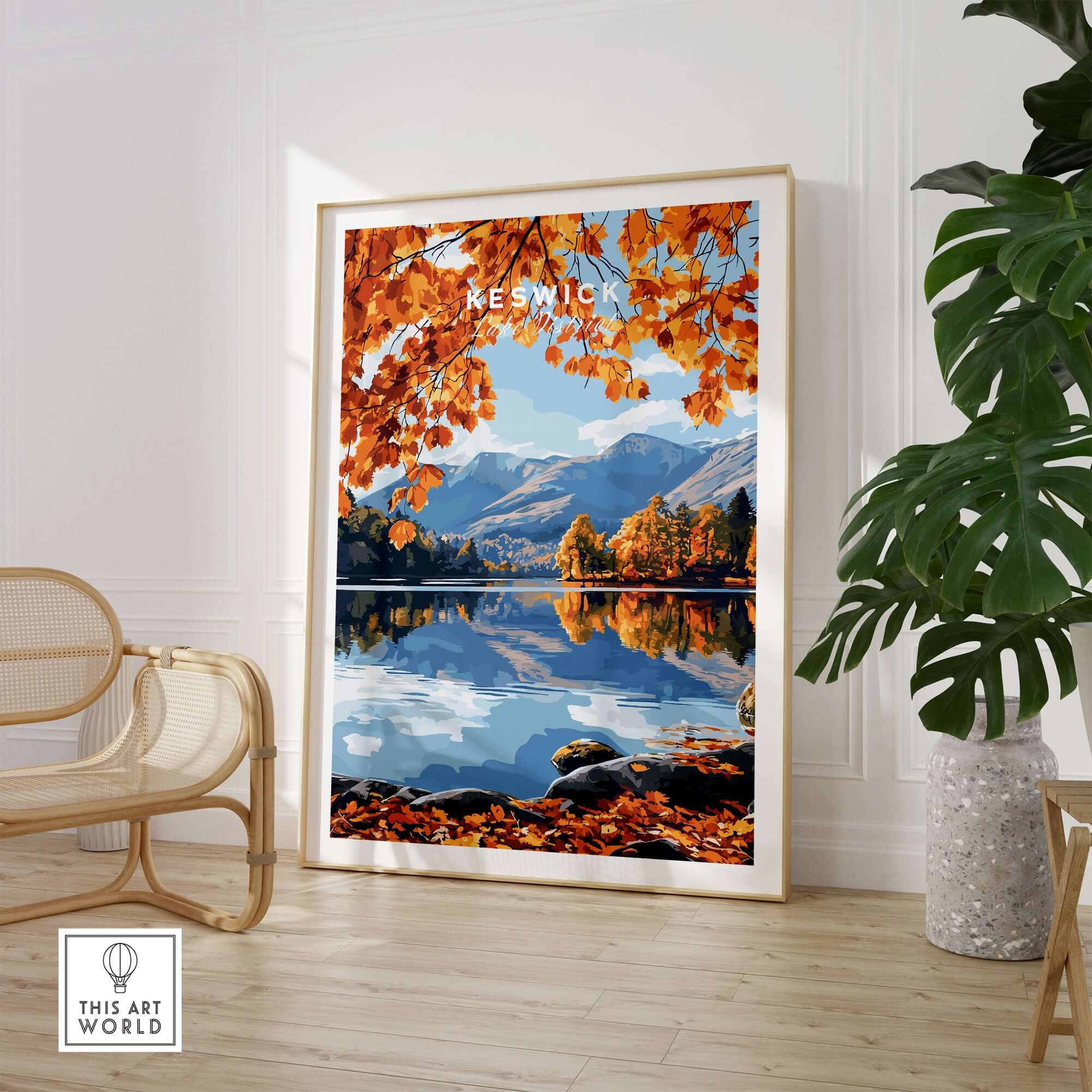 Keswick Travel Print showcasing autumn colors and tranquil scenery of Lake District reflected in water.