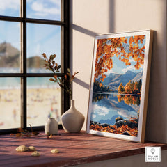 Keswick Travel Print showcased on a windowsill with autumn leaves and a serene lake view in the background.