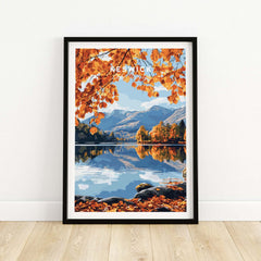 Keswick Travel Print featuring autumn scenery in the Lake District with vibrant leaves and calm waters.