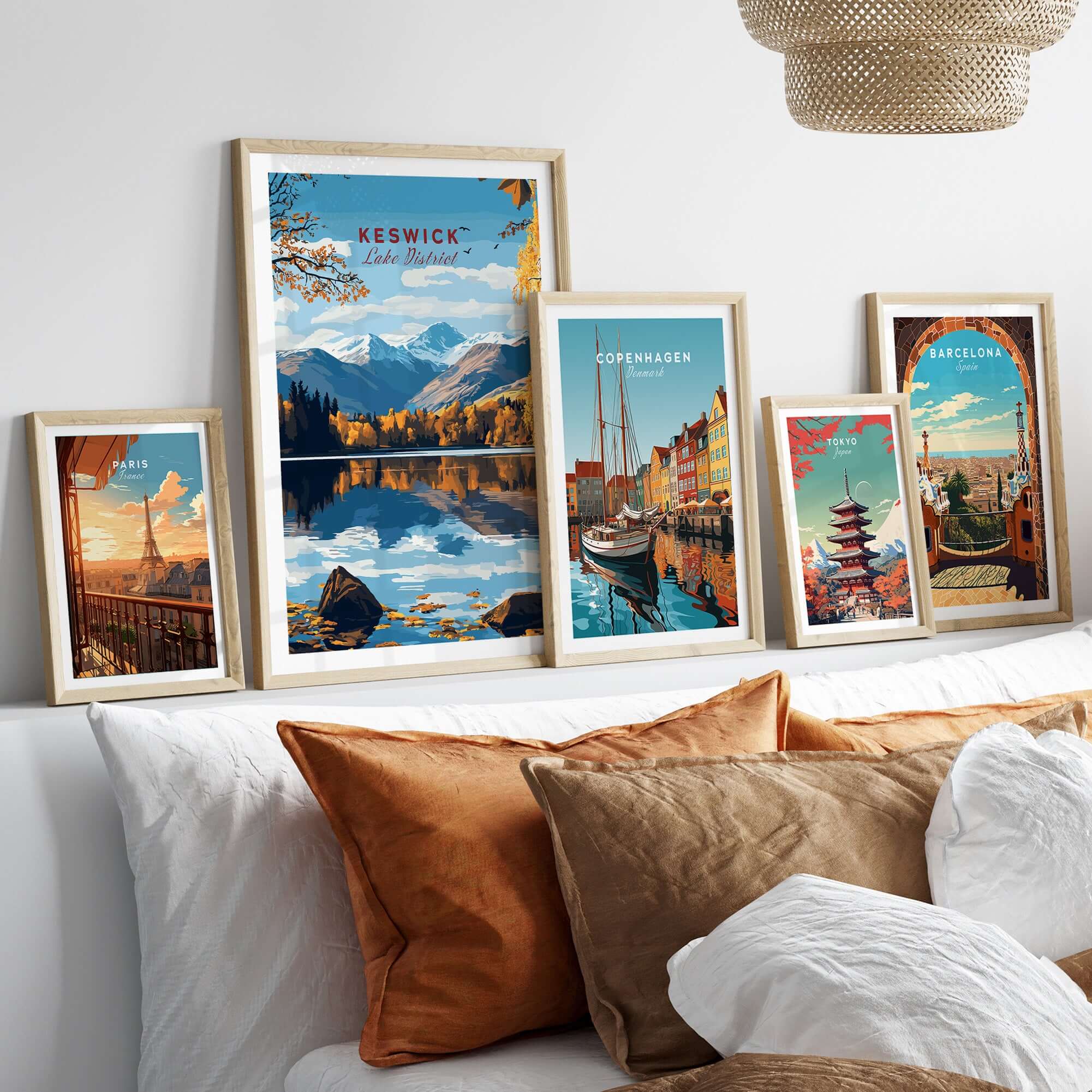Keswick Wall Art collection displayed on a wall above a cozy couch with decorative pillows.