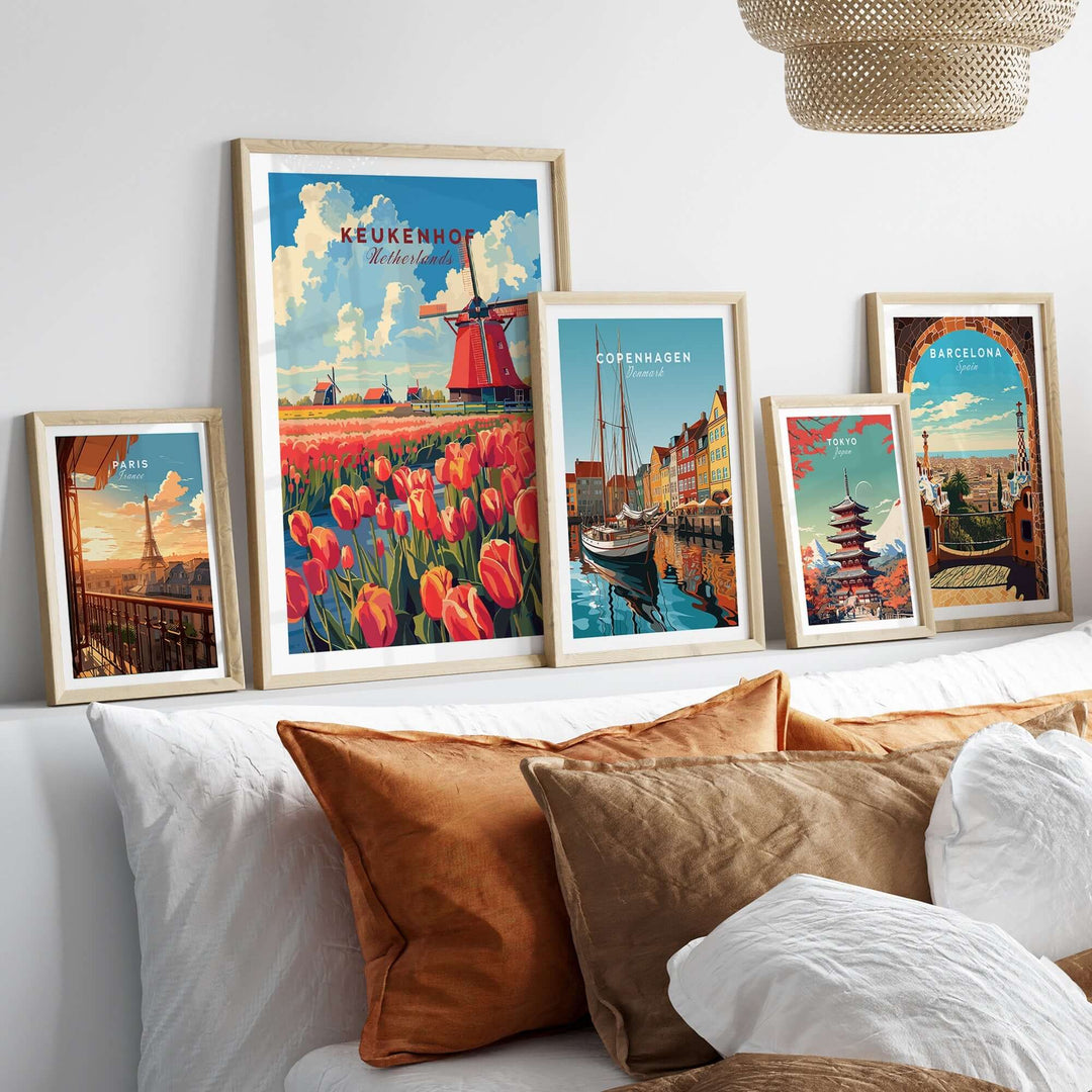 Framed Keukenhof print featuring tulips and windmill alongside other city prints on a cozy sofa decor.